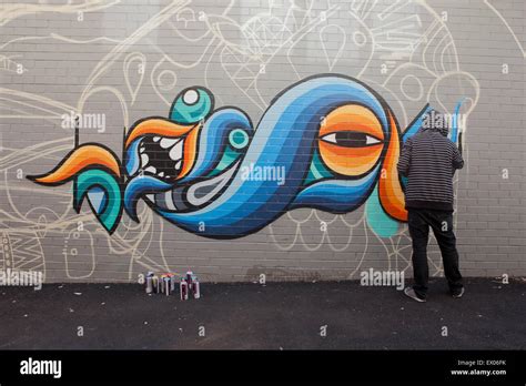 Graffiti Street Artists Paint A Mural In Australia Stock Photo Alamy