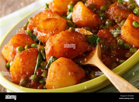 Spicy Aloo Matar Potatoes Green Peas And Spices Close Up On A Plate