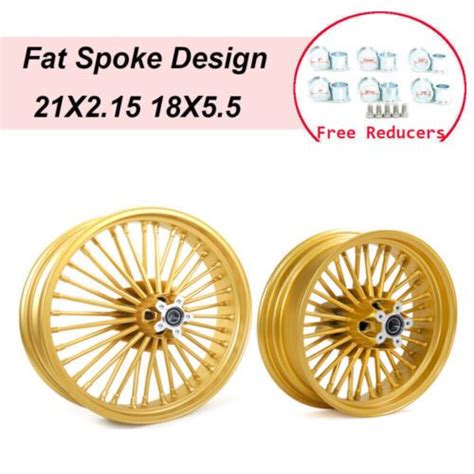 Two Gold Wheels With Spokes On Each Side And One Is For The Front Wheel