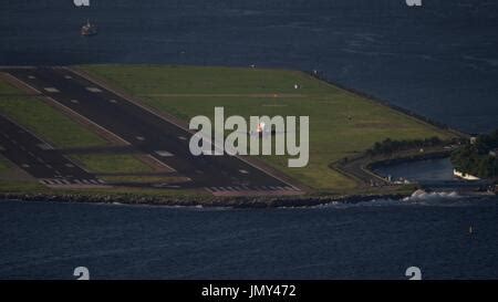 Plane Taking Off At Santos Dumont Airport In Rio Niteroi Bridge In The