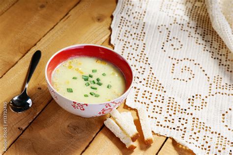 Cream soup, spoon and bread croutons Stock Photo | Adobe Stock