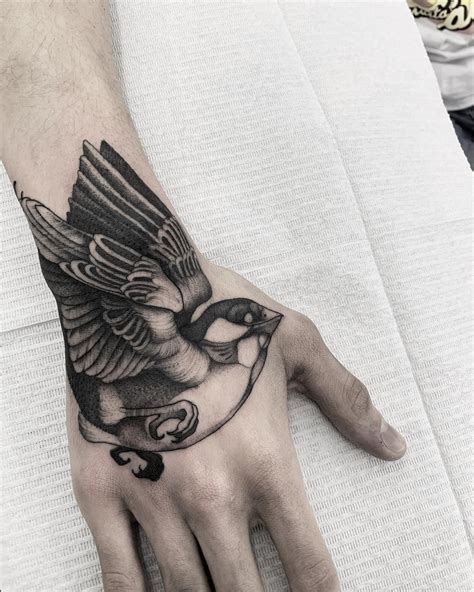 amazing bird tattoo design on hand | Hand tattoos for guys, Incredible ...