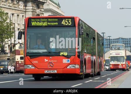 A bendy bus traveling in London Stock Photo - Alamy