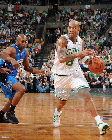 Stephon Marbury Of The Boston Celtics Drives Past Anthony Johnson Of