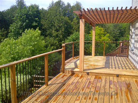 Basement Walkout Interlock With Deck And Pergola Toronto Landscaping Design And Interlock