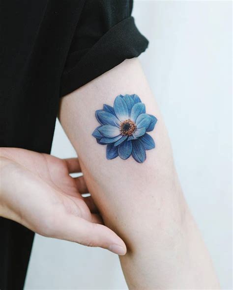 Blue Dahlia Flower Tattooed On The Inner Arm