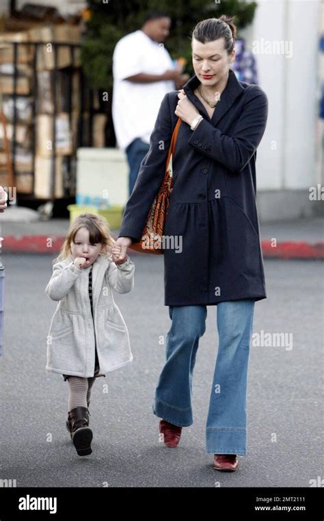 Milla Jovovich And Daughter Ever Leave Bristol Farms After Shopping Together In Beverly Hills