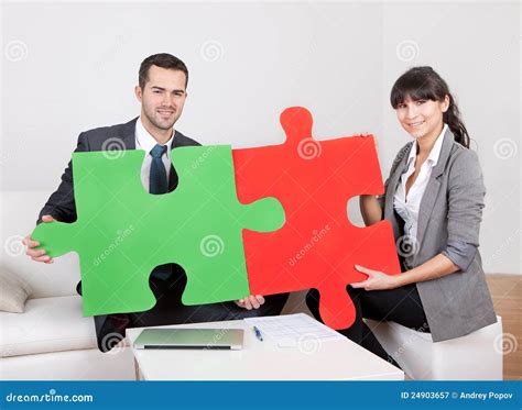 Two Business People Connecting Puzzle Pieces Stock Image Image Of