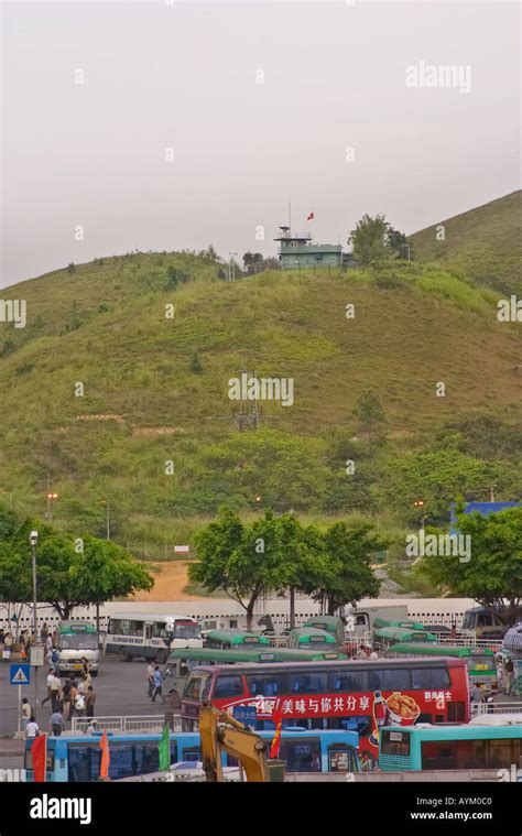 China border guard post with a foreground of a busy parking lot, Hong ...