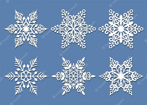 Premium Vector | Set of laser cutting snowflakes isolated on blue