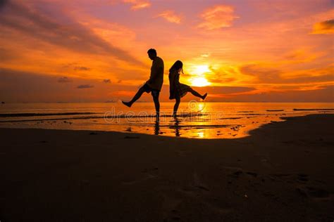 Couple on the Beach at Sunset Silhouettes-Romantic Summer Stock Image ...