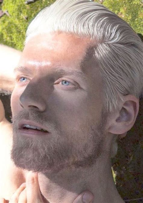 A Man With White Hair And Blue Eyes Is Posing For The Camera