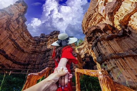 Asian Female Tourists Stand And Watch Cliff Stone Of Pha Chor At Mae