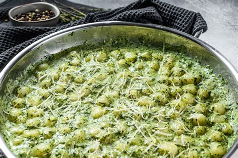 Premium Photo Potato Gnocchi With Pesto Parmesan Cheese And Spinach Italian Pasta