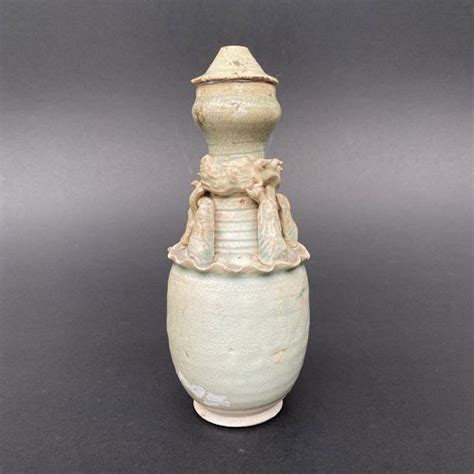 A Song Dynasty Qingbai Glazed Granary Vase With Cover Item