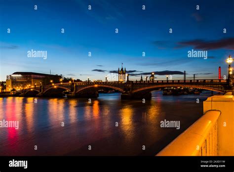 Dusk Reflections On The River Thames At Lambeth Bridge London UK