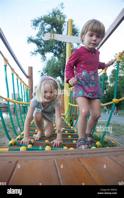 Little Blonde Girl Playing In The Playground Outdoors Stock Photo Alamy