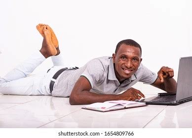 African Lying Man On Floor White Background Images Stock Photos