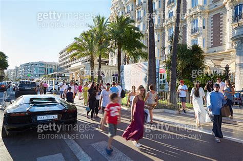 People Walking Along Croisette Boulevard In Cannes In The Afternoon