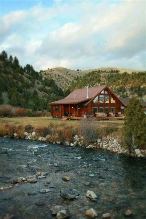 Mountains And A River Make A Perfect Place For This Log Cabin Home