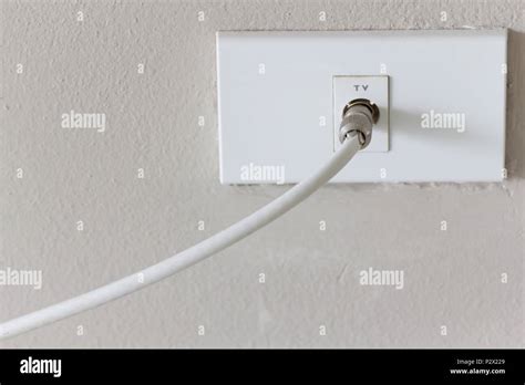 White tv plug antenna electronic on white wall background Stock Photo ...