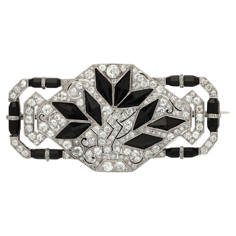 Cartier Art Deco Stylised Diamond And Carved Ruby Bird Brooch Circa