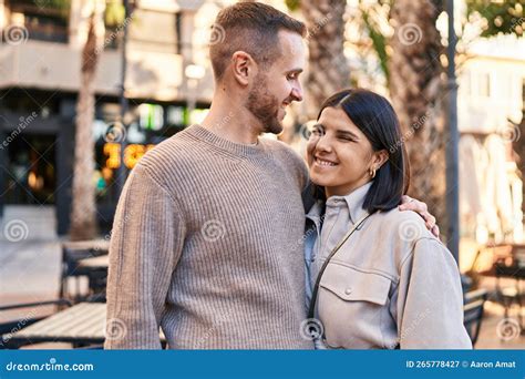 Man And Woman Couple Smiling Confident Hugging Each Other Standing At