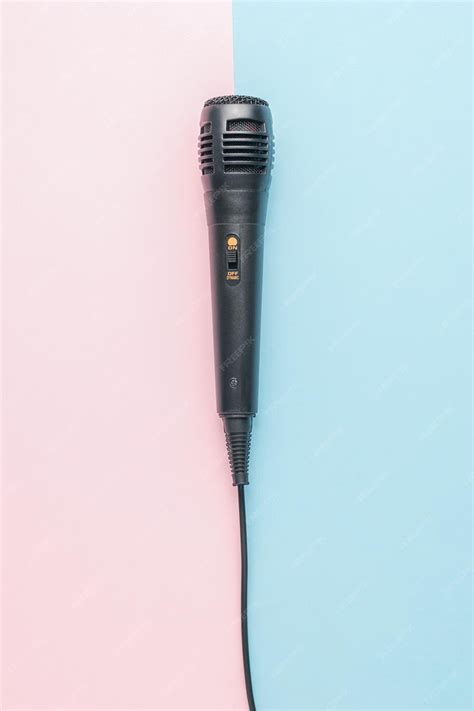 Premium Photo | A classic microphone with a wire on a pink and blue ...