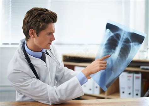 Doctor Xray Scan And Person Review MRI Results For Lung Evaluation