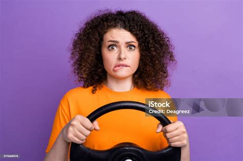 Photo Of Doubtful Unsure Lady Dressed Orange Tshirt Biting Lip Scaring