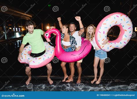 People Dancing With Swim Rings Near Stock Image Image Of Excited