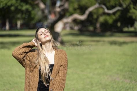 Portrait Of Blonde Woman Posing In A Park Stock Image Image Of Female Fashion 305974111