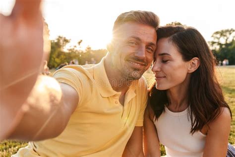 Smiling Cute Adult Loving Couple Outdoors In A Beautiful Green Nature