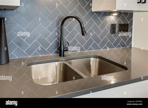 An interior design of a tap in a modern bathroom Stock Photo - Alamy