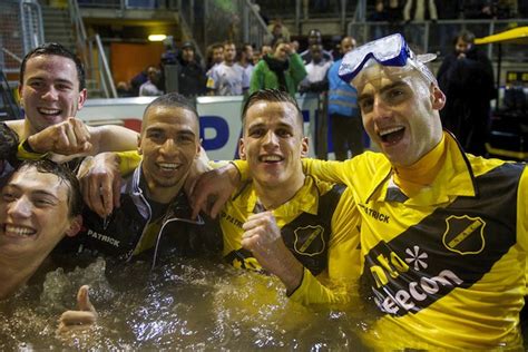 NAC Breda players celebrate win in pitchside jacuzzi with fans