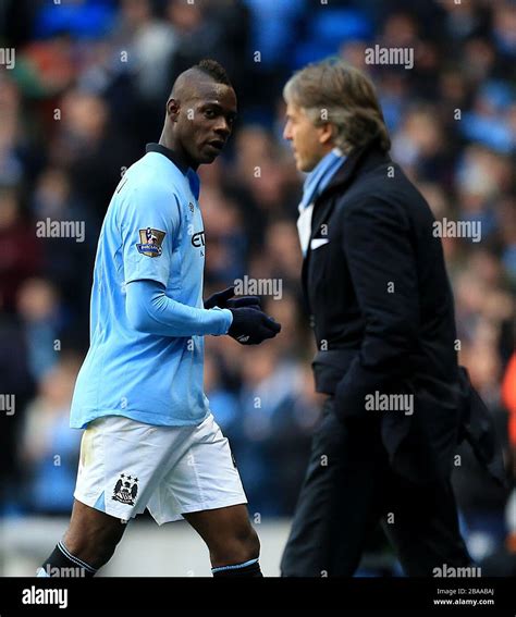 Manchester City S Mario Balotelli Left Looks Towards Manager Roberto