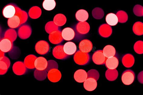 Unfocused Abstract Red Bokeh On Black Background Defocused And Blurred