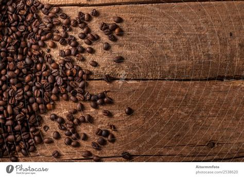 Coffee Beans On Wooden Table Background A Royalty Free Stock Photo