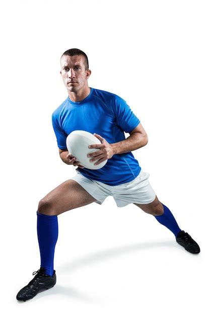 Premium Photo Full Length Of Rugby Player Exercising With Ball