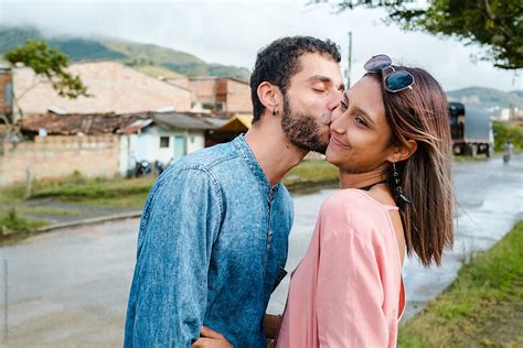 "Boyfriend Giving A Peck On The Cheek To His Girlfriend" by Stocksy ...