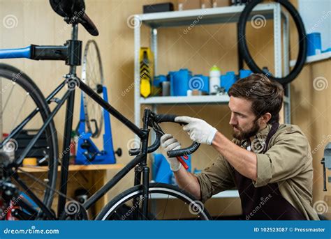 Adjusting Handlebar Height stock image. Image of worker - 102523087