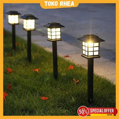 Jual Lampu Taman Outdoor Tanam Tancap Tenaga Matahari Surya Solar Cell Anti Air Minimalis Warm