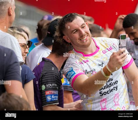 Cameron Smith 13 Of Leeds Rhinos Poses For A Selfie With A Fan After