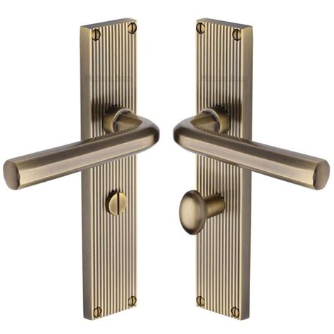 Heritage Octave Reeded Bathroom Door Handles Antique Brass Lacquered Broughtons Lighting