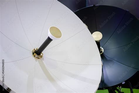 White satellite dish antenna, VSAT parabolic receiver using to receive or transmit information ...