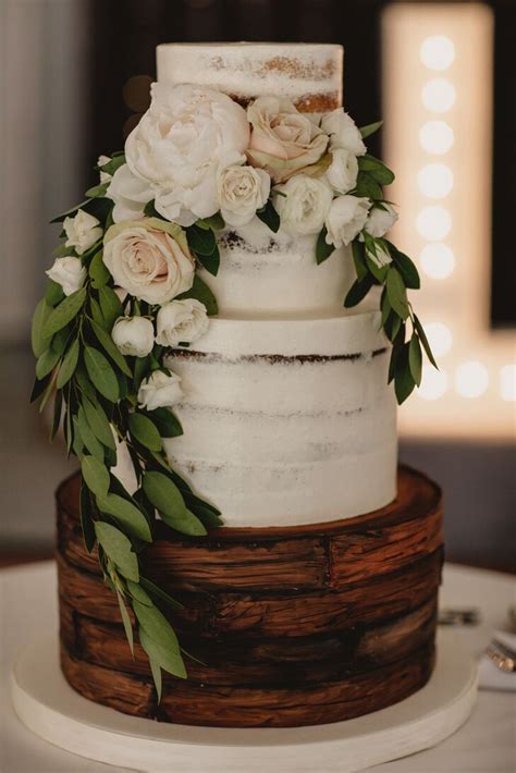 Rustic Naked Cake With Leaves And Layer Of Wood Painted Frosting