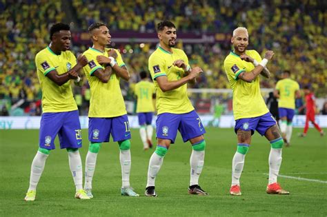 Brazil boss Tite, 61, joins in the dancing as Richarlison, Neymar and Vinicius Junior turn on ...