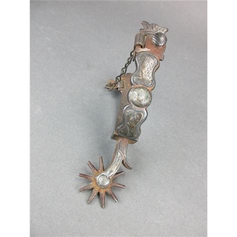 marked hand forged steel silver inlaid single spur chased