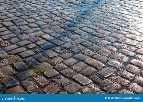 Detailed Close Up View On Cobblestone Streets And Sidewalks In High