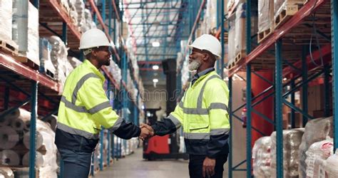 Handshake Logistics And Men In Warehouse For Deal Agreement And